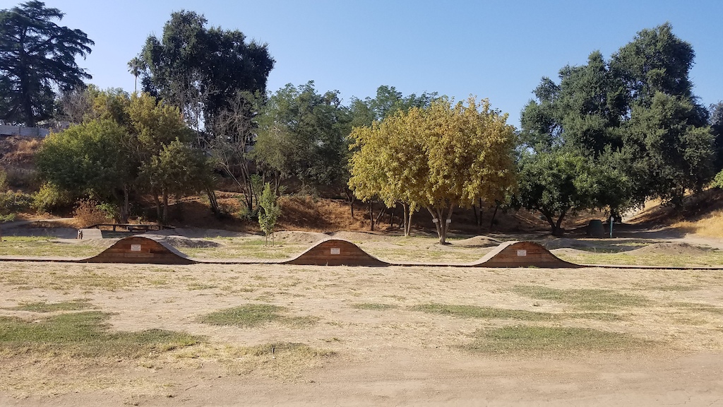 Pump track, wooden rollers, a couple of small jump features along the trail