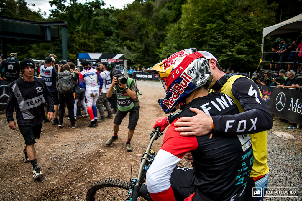 Bruni consoles and congratulates the last man down the mountain on his podium finish.