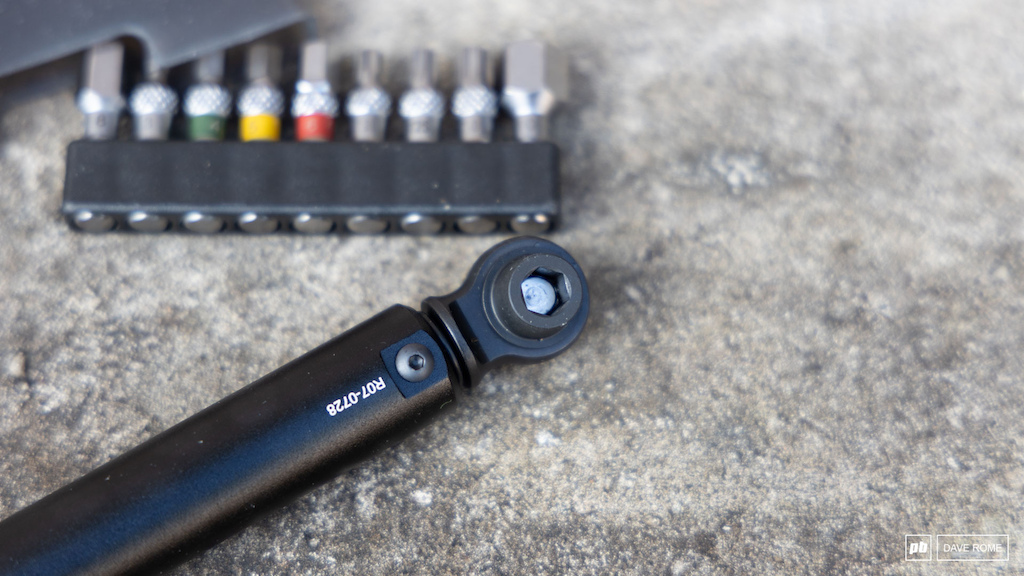 This click-type torque wrench ranges from 4-20 Nm in .5 Nm increments and offers an impressively compact ratcheting head. The tool includes nine common size 1 4 tool bits. Adjusting the torque is done with the locking handle at the base.