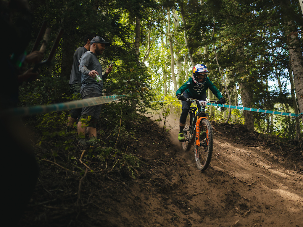 Jill Kintner riding a steep loose line at Purgatory as the spectators cheer her on. Photo dirkbadenhorst