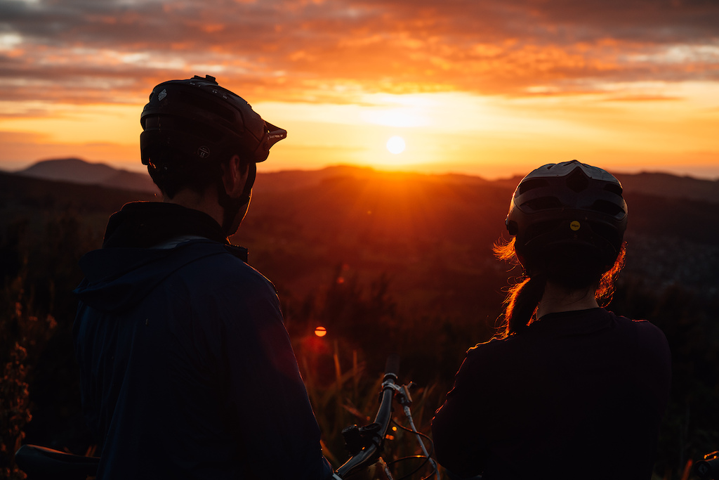 Joe and Katy taking in a gorgeous Dunedin sunrise, waiting for the light to get right before heading down.