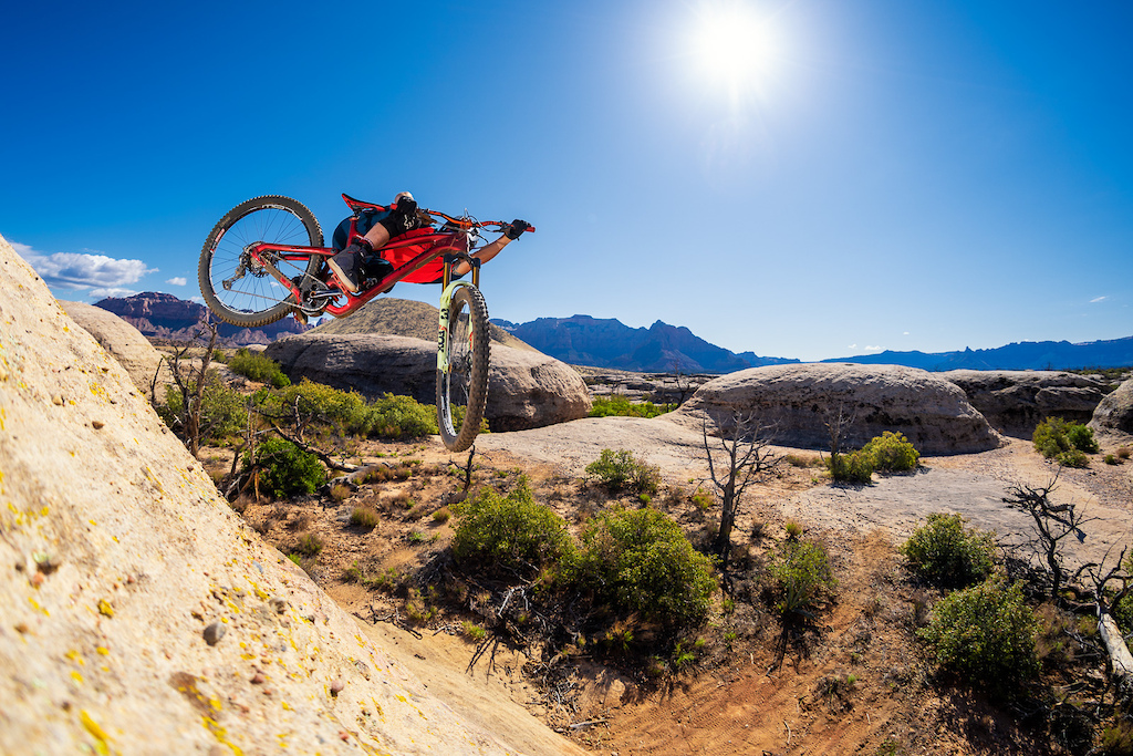 Kirt Voreis getting all tucked up on a natural quarterpipe in Utah