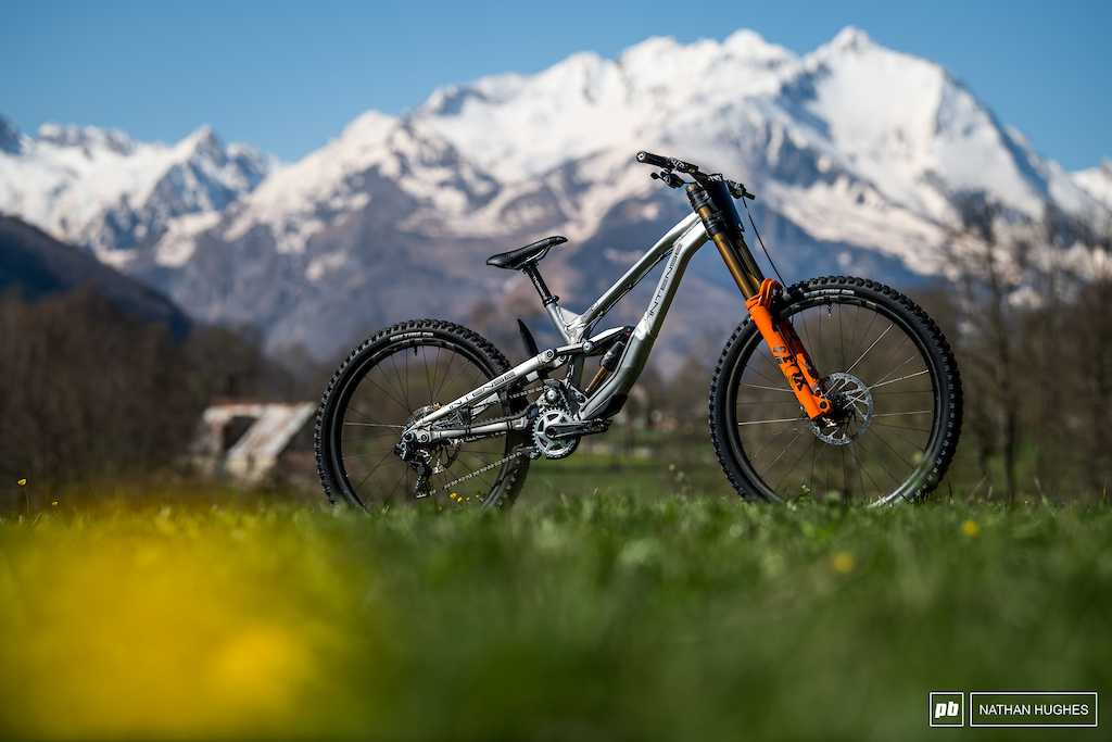 Aaron Gwins prototype high pivot Intense infront of the formiddable Pyrenees.