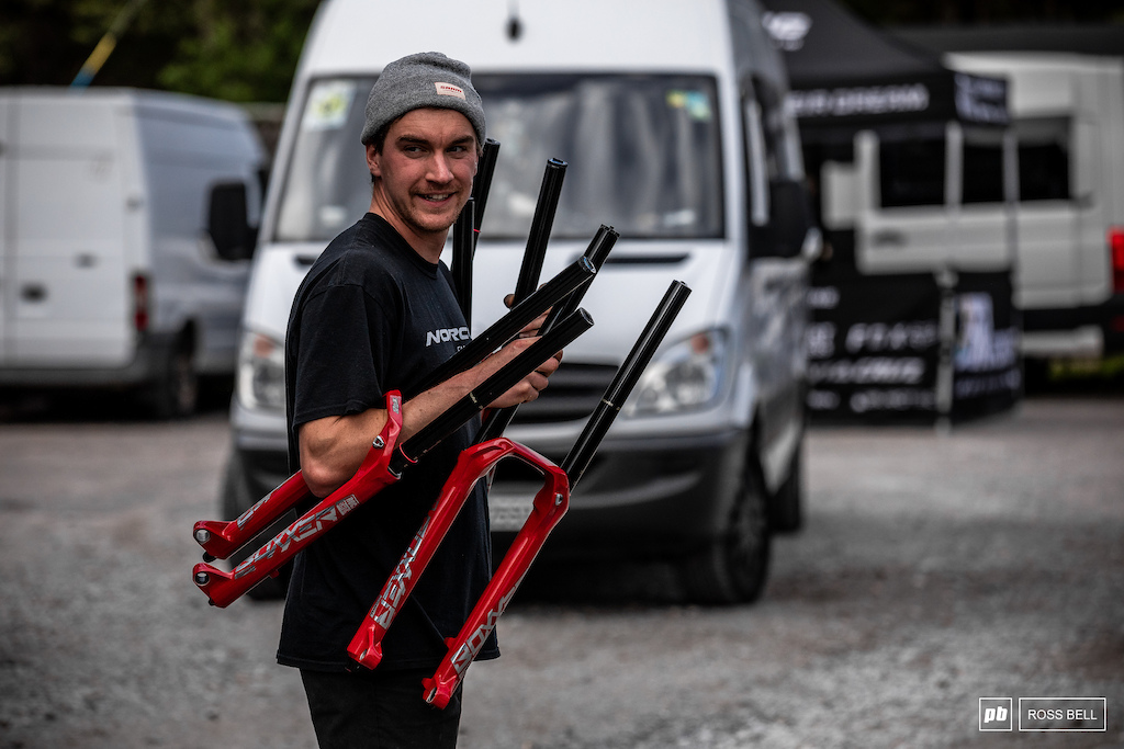 Norco mechanic Lewis Kirkwood juggling his riders Boxxer forks after a service at SRAM.