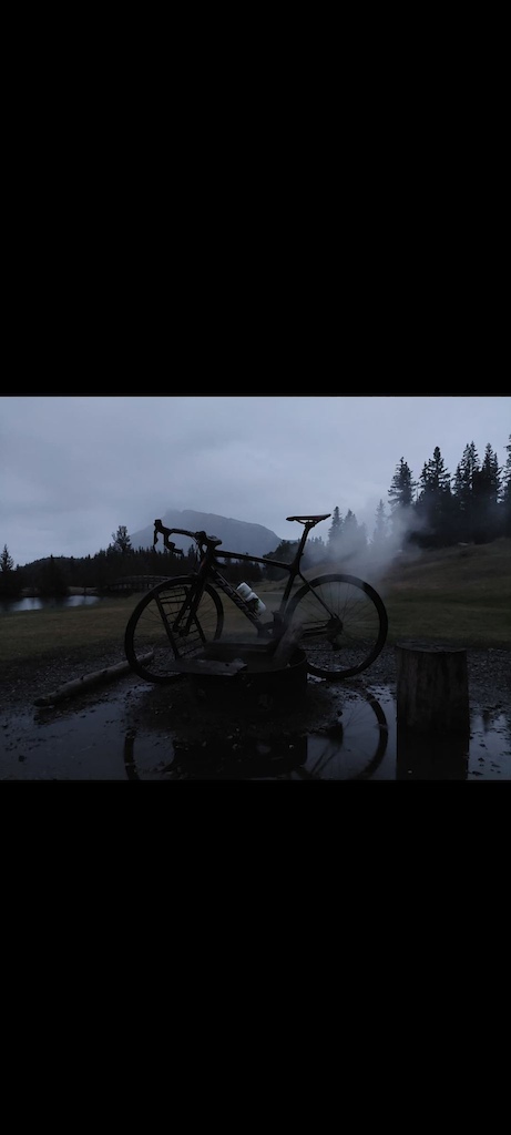 Got mildly hypothermic riding from Canmore to Banff and back on this moody night. All the firepits in front of the Minnewanker loop were still smoldering mid forest fire season. Put em all out though. Made for a great photo op. Wear rain gear on wet rides.