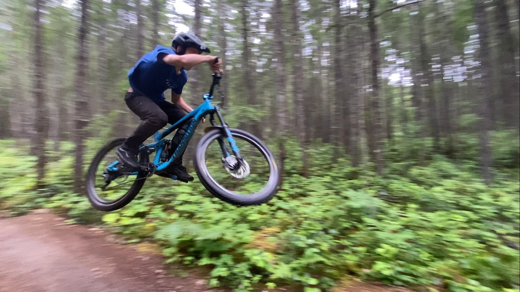 Rider jumping on a mountain bike trail in nanaimo