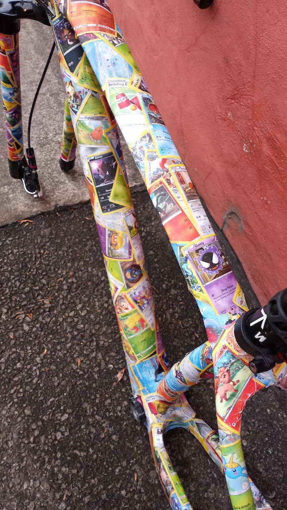 This is my...Poké-bike 
.
.
.
Let me know what you think. Would you ride this bike plastered with pokemon cards? 
.
If you're curious about the 6 day process I've loosely outlined it below  
.
But seriously tho this took 5 or 6 days and countless hours of labour to basically wrap my entire frame and fork in pokemon cards! 
.
The process started with soaking the cards in water to allow the layers of paper to separate. Separating the cards was totally brutal. This was an experimental process (ive never seen it done) and took alot of trial and error to get it right.
.
When I eventually figured that all that out, I "paper machéd" the frame with a water bucket of mush at my side(this took 6-8hours). It involved alot of flipping and positioning cards and bike frame and I was stuck in terrible positions alot of the time
.
Once dry, I then went back over the entire frame with clear UV proof epoxy. 2 coats of that with drying time in between and after all that wait time, here is the fruits of my labour hahahhaha
.
.
This bike gets daily ridden back and forth to work every day, rain or shine. And most recently threw a harsh canadian winter so I can post photos of how it's holding up
