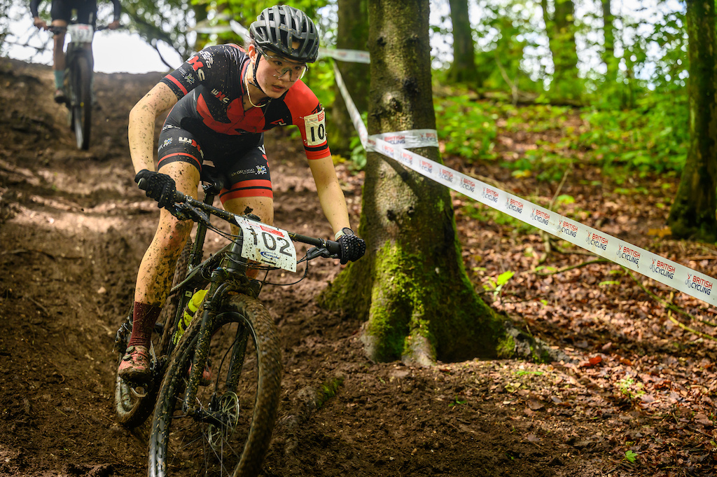 Phoebe Roche on the gas on one of the descents through the woodland