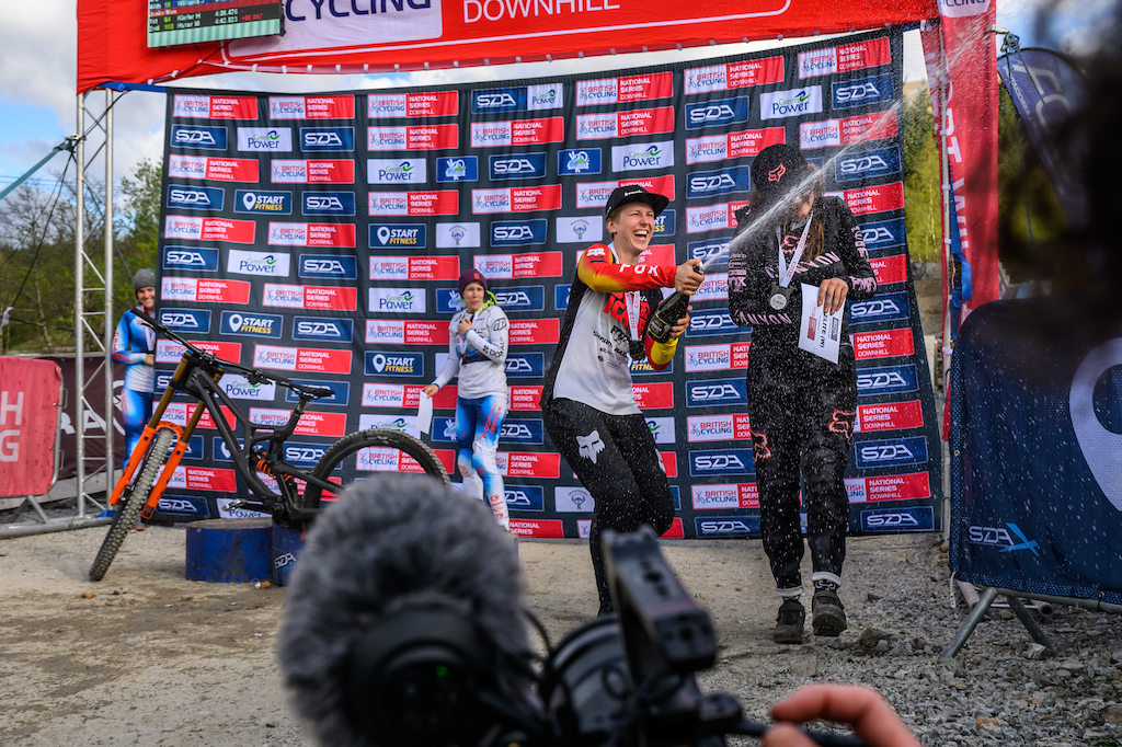 Nina Hoffman went straight for team manager Steve Peat with the champagne