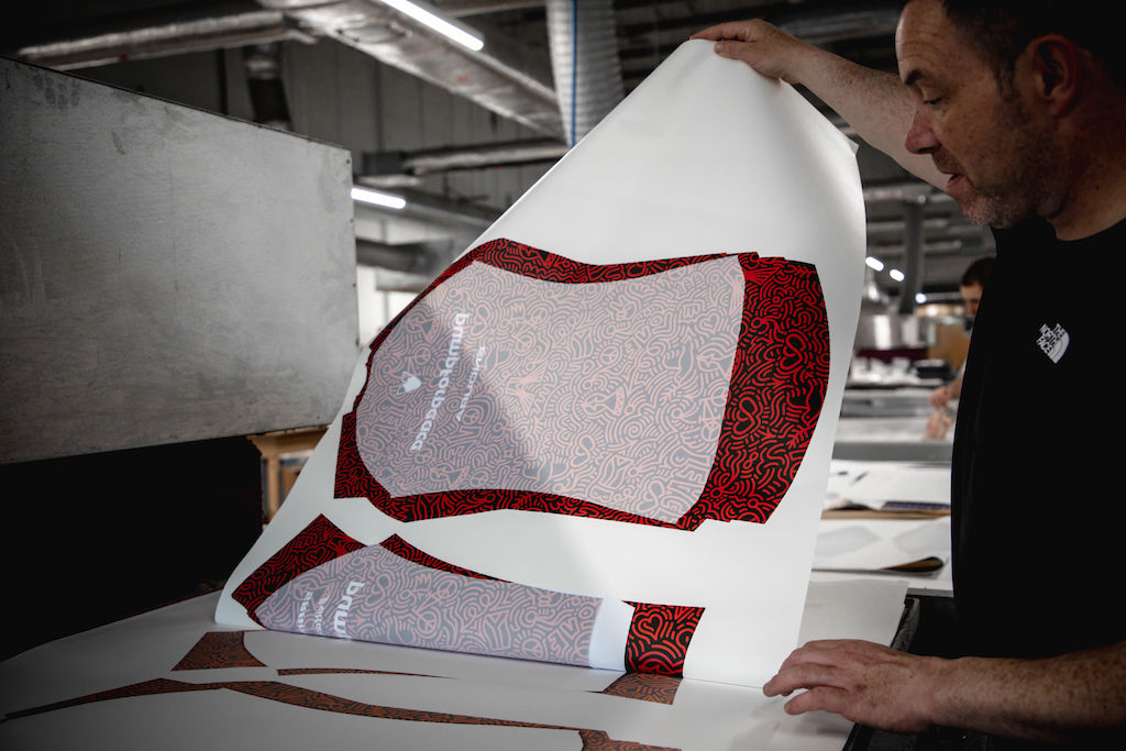 Endura custom kit production in Scotland - heat pressing.