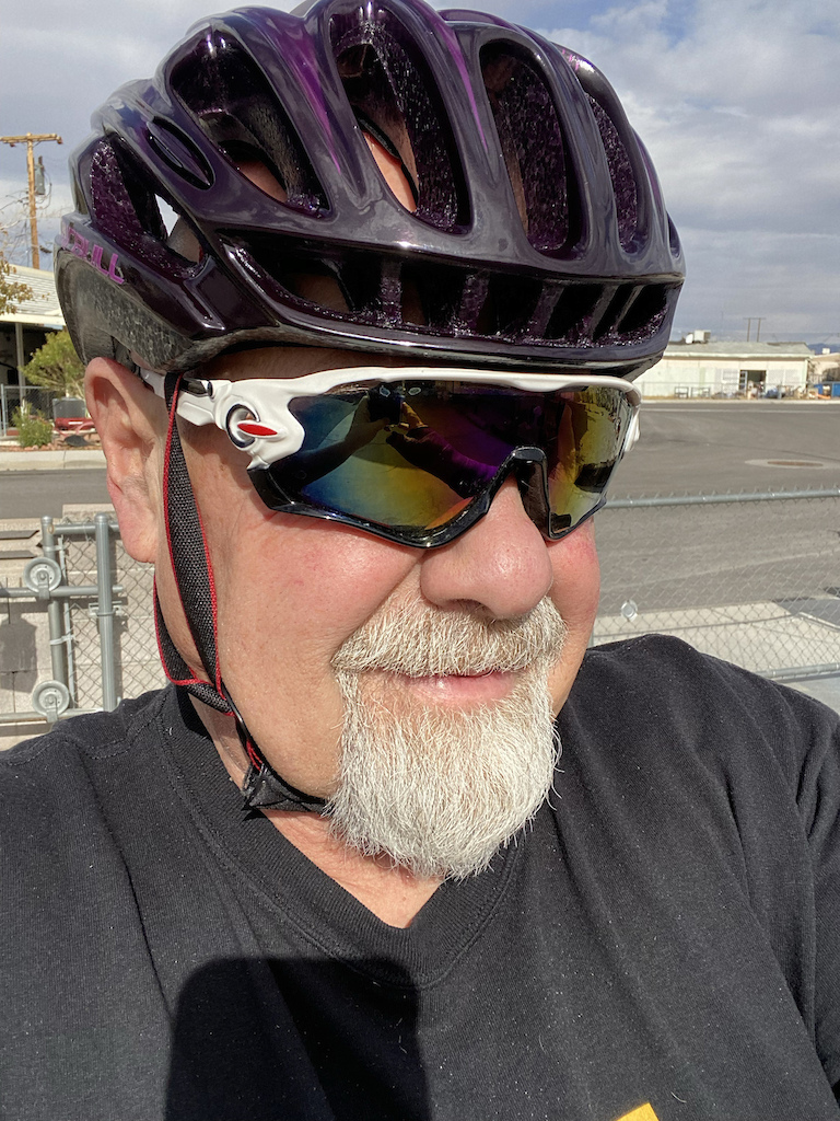 * Custom-painted "CAIRBULL" FULLY vented road helmet in 2022, to use while riding my Argon 18 Krypton in the USA, and while my Cervélo in the Philip[pines.  The polycarbonate outer liner is fused to the molded  EPS foam shell, which I am sure it a nice feature but made it harder to custom paint. I bought a black helmet, laid down silver stripes, and then painted the whole thing a translucent purple. So it is 
Two-tone" - lighter purple stripes over a VERY DARK Purple, or Black, depending on the light. The skull-locking sport harness system provides tons of fit adjustment while mimicking the full-circumference tightening of high-end helmets. It is very comfortable and VERY cool, but I need a "Durag" to keep from getting a very weird-looking suntan. (lol)