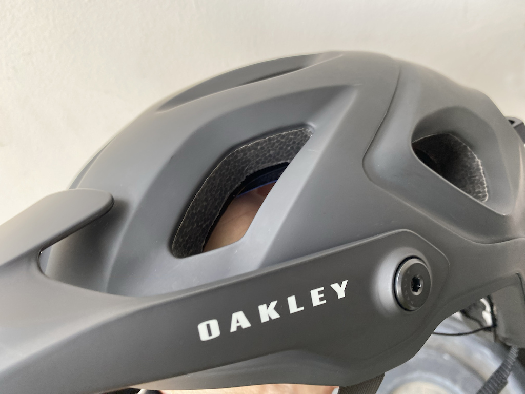 The Oakley DRT5 Trial/Enduro Mnt. Bike Helmet - Showing the Oakley logo on the Visor.