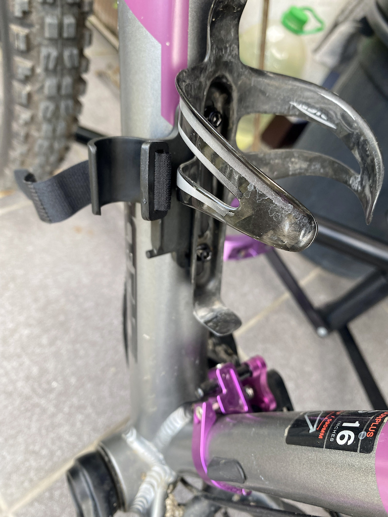 My-FELT-Surplus30-Plus - Upgrade - Tire Pump clamp. Typical mounting under the Water Bottle Cage. The clamp holds the pump tight, backed up with the Velcro strap.