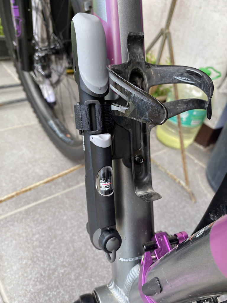 My-FELT-Surplus30-Plus - Upgrade - Tire Pump clamp. Typical mounting under the Water Bottle Cage. The clamp holds the pump tight, backed up with the Velcro strap.