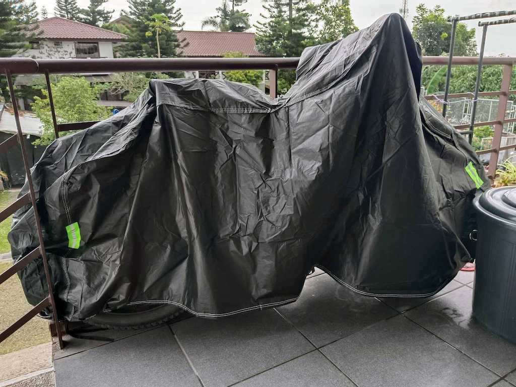 Since I have been putting the bike out on the porch most days, I bought a motorcycle cover for the FELT.  It is a 3-Layer design - soft inner, with a 100% rainproof layer above, and an outer UV-protected Layer. 

FEATURES INCLUDE: 
* LIGHTWEIGHT: Plus it comes with a fabric storage pouch and a Zip-lock bag.

* ANTI-THEFT DESIGN: With Two large lock-holes at the front hem to allow for cable locks, preventing theft as well as, helping to keep the bike secure on windy days.

* WATER AND DUST-RESISTANT: Outer and second layers are made from 100% waterproof fabric, to protect the motorcycle against water seepage and wind, with a PU coating on the Nylon layer to keep sun damage at bay.

* UNDER STRAP/BUCKLE SYSTEM: A buckle in the underside stabilizes the cover over the bike, safeguarding it on the VERY windy days, and often stormy days here in the Philippines.