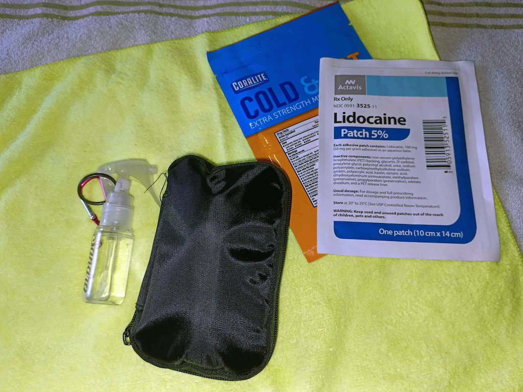 Everything but the rubbing alcohol, and the patches are contained in a re-purposed zippered pouch from a Diabetes blood sugar reading kit.  Everything is ready to be stuffed into the Hydration pack at this point.