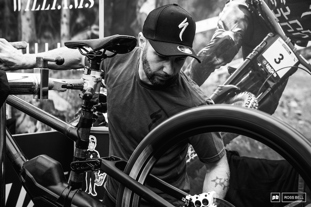 Kev Joly gives Finn Iles' bike one last check over.