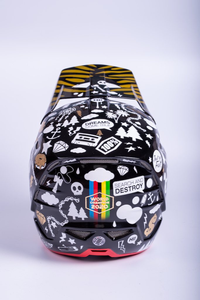 Custom painted helmet to celebrate Reece Wilson's 2020 World Champs win. Zebra stripes, loads of little illustrations, black and gold. Gold medals are a good excuse to break out the gold leaf!