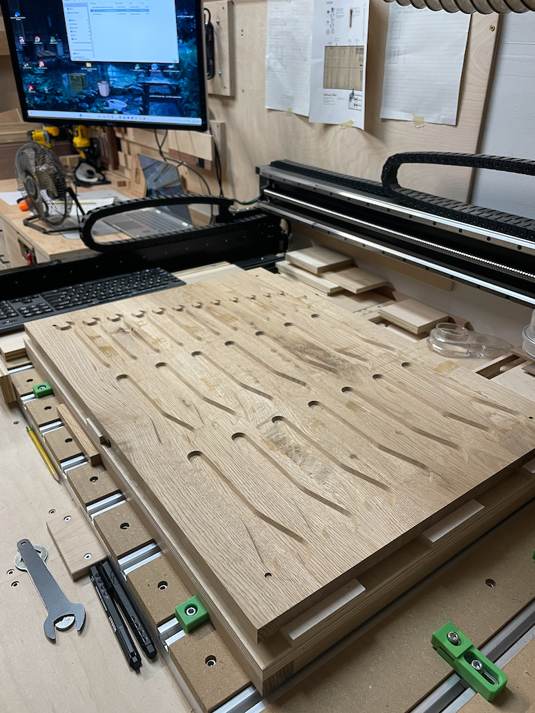 CNC Panels: Tool silhouettes were milled directly into the oak panels using a CNC machine for precision and repeatability.