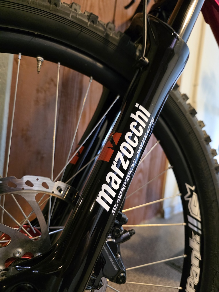 Fully repainted:

Frame to Candy Red
Fork Gloss Black
Logos Karpiel / Marzocchi painted too :) 
Karpiel logo made from the scratch 3

New handlebar, new seat, new 3.0 tires