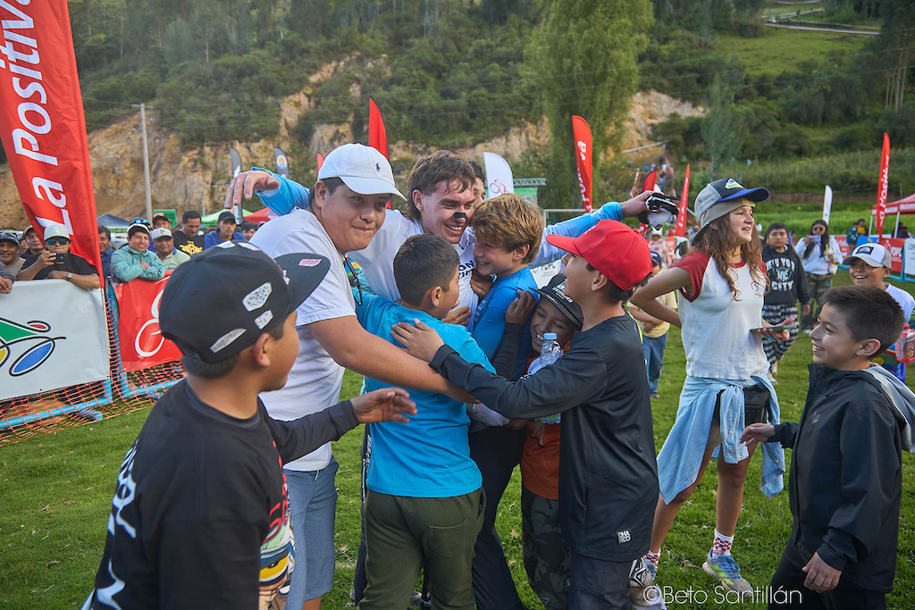 Gonza Gajdosech — The greatest trophy of the day has no gold and no podium step. It is this — a champion completely swallowed by a wave of pure, joyful children who rushed the finish area just to get close to their hero. Gonza doesn't step back, doesn't hesitate — he opens his arms and lets every single one of them in. This is what a true role model looks like. He conquered the mountain today, but it is moments like this that conquer hearts forever. The Sacred Valley gave him a race win. He gave it back something far more valuable.