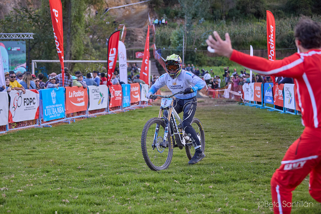 The moment everything becomes real. Gonza Gajdosech — Campeón Argentino — rolls across the finish of Santísimo DH 12 still processing what he has just achieved, while Peru's own Lucio comes sprinting into frame with open arms and a heart bursting with genuine joy for his rival. Two nations, one sacred mountain, and a moment of pure human connection that transcends borders, flags, and competition. This is what true sportsmanship looks like — a Peruvian celebrating an Argentine's victory as if it were his own. The Andes witnessed something special today.