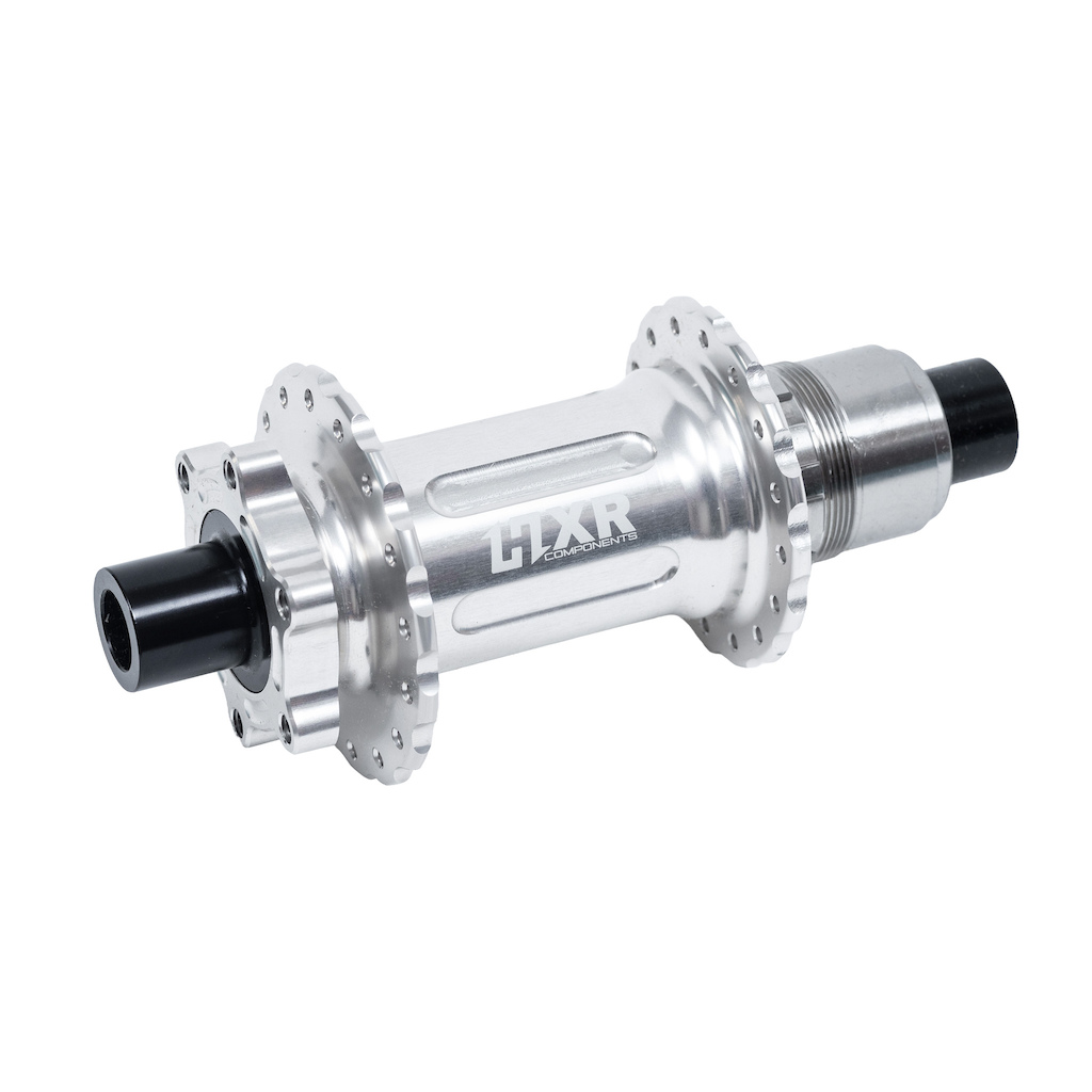 driver, and features only 6 degrees of engagement.

The flanges are spaced as far apart as possible for greater rigidity.

This is the MTB rear hub for all demanding riders looking for efficiency, quality, and design.

Comes with a locking spacer to secure the hub and allow use with the Easy Shift crankset.

High-performance MTB rear hub for Trail / Enduro / DH / VAE / E-bike, capable of handling the most intense rides.
Fully CNC-machined

Material: 7075 T6 aluminum. High-end aluminum (used in aviation) to withstand impacts and extreme stress, while remaining lightweight for increased performance.

Grade 5 titanium freehub body (to prevent marks on the freehub body, facilitate cassette removal, and increase the lifespan of your hub).

Ratchet with 60 engagement points.

32 holes.

6-hole disc mount: Compatible with most discs for powerful and consistent braking.

Grade 5 titanium freehub body: Shimano HG or XD (Shimano Microspline on request).

Sealed bearings, protected from dust, mud, and moisture for increased durability and reduced maintenance.

Finish: Black anodized or clear.

Dimensions: 148x12 mm or 150/157x12 mm.

Weight: 257 grams.
