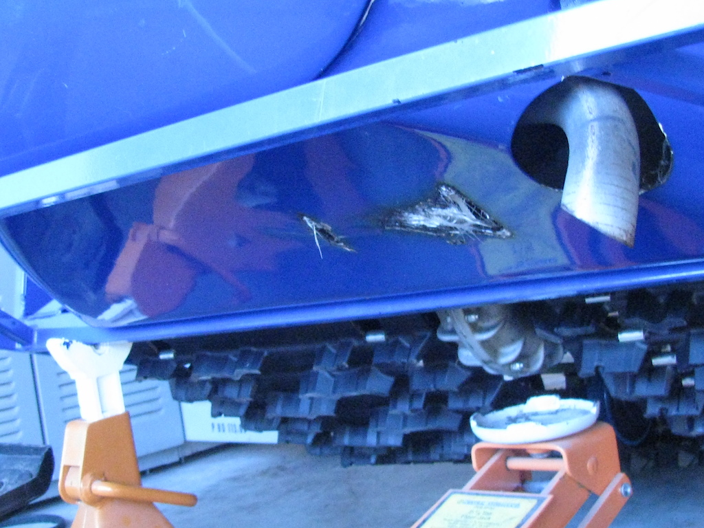 this is where the muffler came off of its mounts and damaged the fiberglass, it is under the nose of the machine.