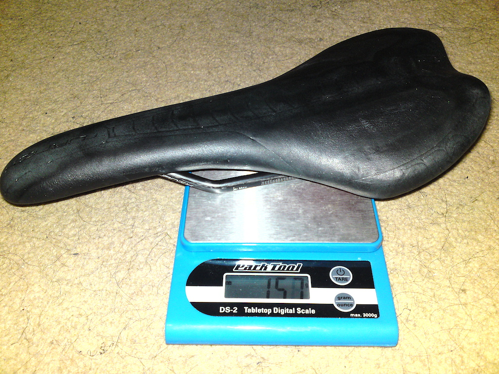 Pro Turnix saddle w/carbon rails. I inhaled too much acetone stripping off those decals.

Like, 157g or something, I need a new battery too.....