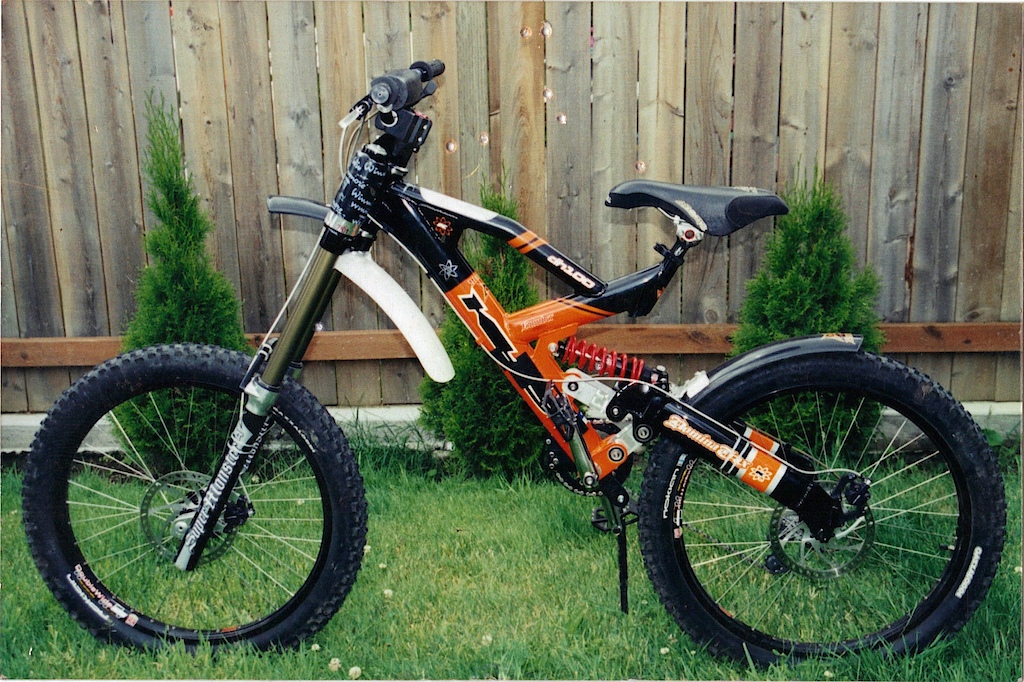 not mine, but this khs dh100 fetish has 10 inches of travel (romic shock/ custom linkage) in the rear and a marzocchi super monster t on the front, not mine dont ask. thought i would share this beast with the world, it does not look half as stupid as bikes i seen with a super monster