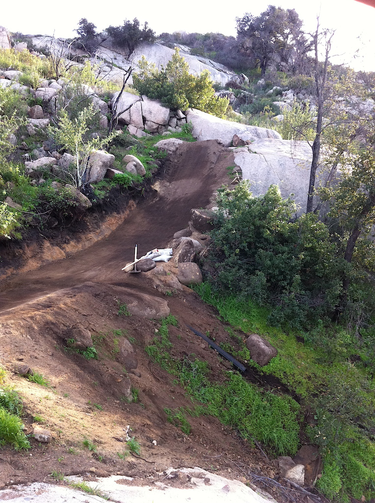 34- side view of step up, boulder has a flat top and perfect natural granite landing on backside