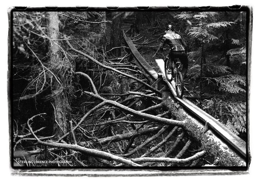 Scott Grieve riding PreReaper trail on the North Shore of BC in the fall of 1998. Yes, that is fresh snow on the log and teeter totter....