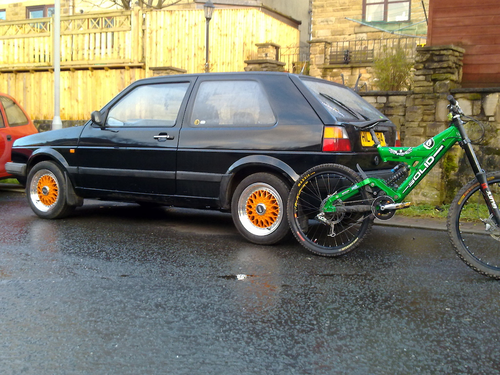 my golf afta we painted wheels and put a tow bar on it with my bike next to it