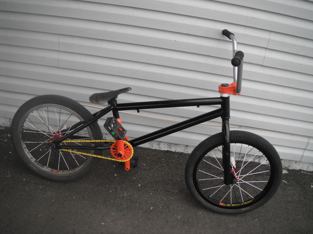 My Kink Launch bmx with new oddysey hazard light rims. the back hub is a shadow conspiracy raptor hub with shadow hub guard. the front has a fly hub. two good white pegs and both rims are laced with white and black spokes.