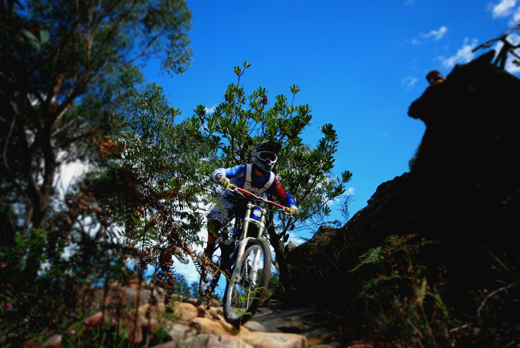 Ryan skimming over a rock garden at local