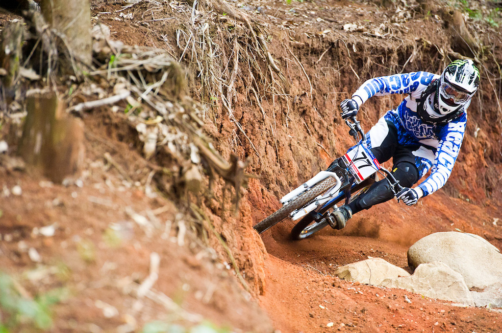 Lukas Machura of Chain Reaction squeezing into a tight spot during 4X qualifying.