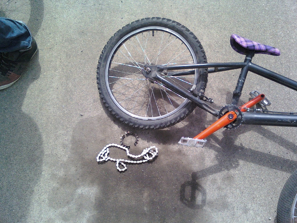 all we heard was a snap noise then he lifted his bike up and discovered this..  shit