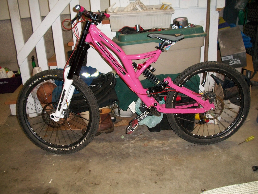 Frame-2004 Norco Team DH 9" or 8.6" of travel (panther pink with custom flat black cut out decals) 
Rear Shock-2011 Marzocchi Roco WC
Fork-2011 Marzocchi 888 RC3 EVO Brakes-Avid Code 5 with stainless lines Headset-Race Face Diablous Rims-Syncros DP-32 
Hubs-Dirty Playa/Sun Ringle Abbah DH Cranks-Race Face Diablous Chainguide-E-13 
BB-Race Face Evolve DH external Stem-Marzocchi intergrated 
Bar-Race Face Atlas 
Grips-ODI lock on (pink) 
Saddle-Funn
Pedals-Crank Bros 50/50 (pink plates) Drivetrain-Sram x9 
Tires-2.5 Norco Team