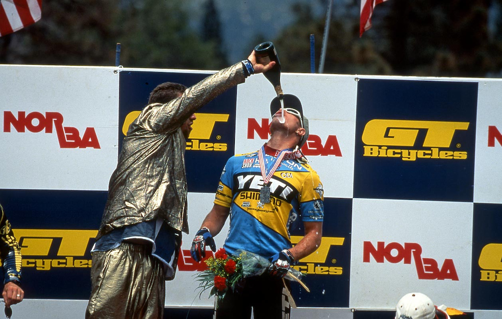 Kirt Voreis celebrates his podium finish at Big Bear with a little help from Shaun Palmer decked out in his gold lamae suit.