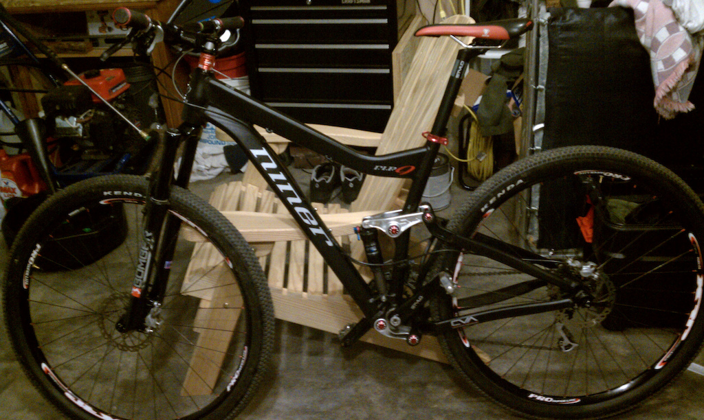 My new ride after it's first ride and before I put my new Token saddle on. In my messy garage that's now organized!