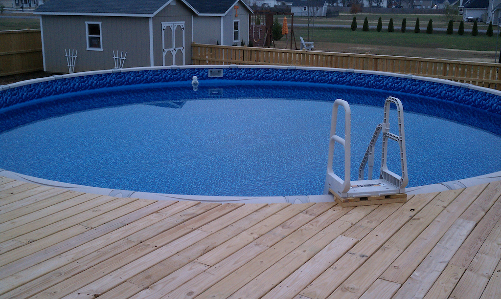 Our pool to relax 2010. My neighbor Allen and I build the deck from his idea!