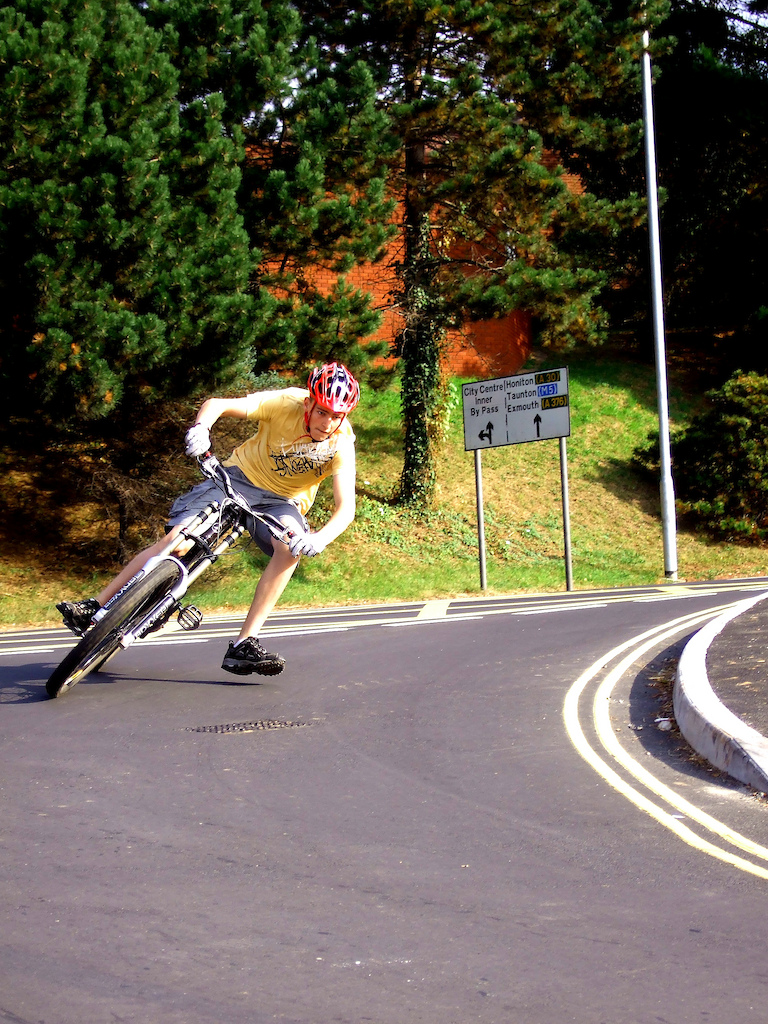 Me a few years ago attempting to to get as low as possible as fast as possible on a sharp bend off a main road!

I did crash and got owned....