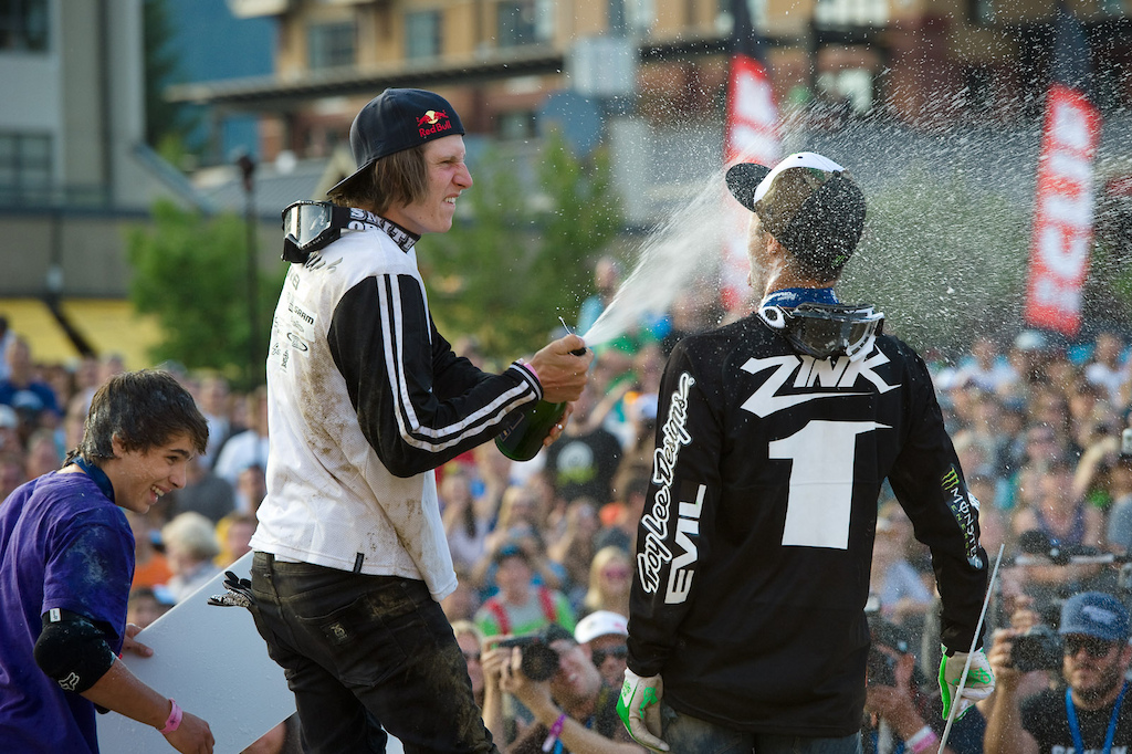 Brandon Semenuk celebrates with Cam Zink and Anthony Messere on the podium at the Red Bull Joyride event in Whistler BC on July 23, 2011