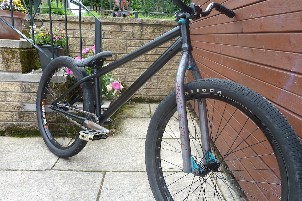 got bored, attacked the bike with sandpaper, got bored, gave up and painted it black