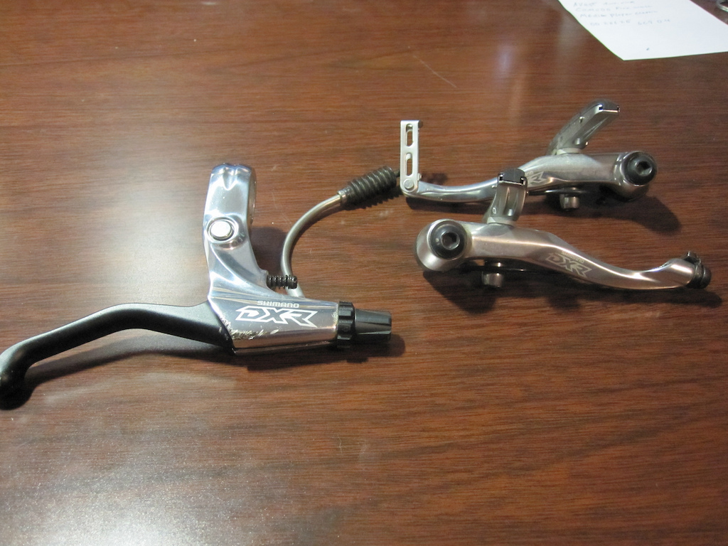 Shimano DXR V-brake set. with just a little road rash on the brake lever. works great pads still have just about full life.