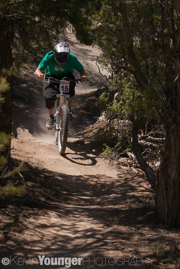 Trevor Martin blasts through a small bit of light on a course that weaves through trees, over triples and quads, and around berms at the 2011 RanchStyle Slalom.
© Kevin Younger