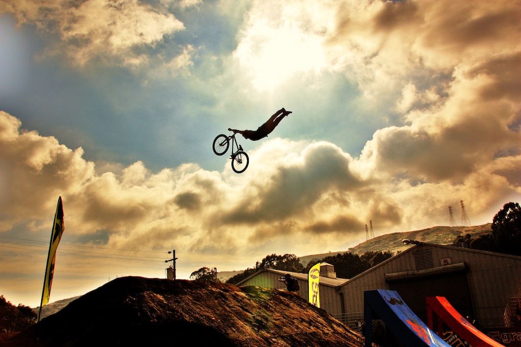 Andreu throwing an MX style superman above the skyline at the Cow Palace during qualifiers.