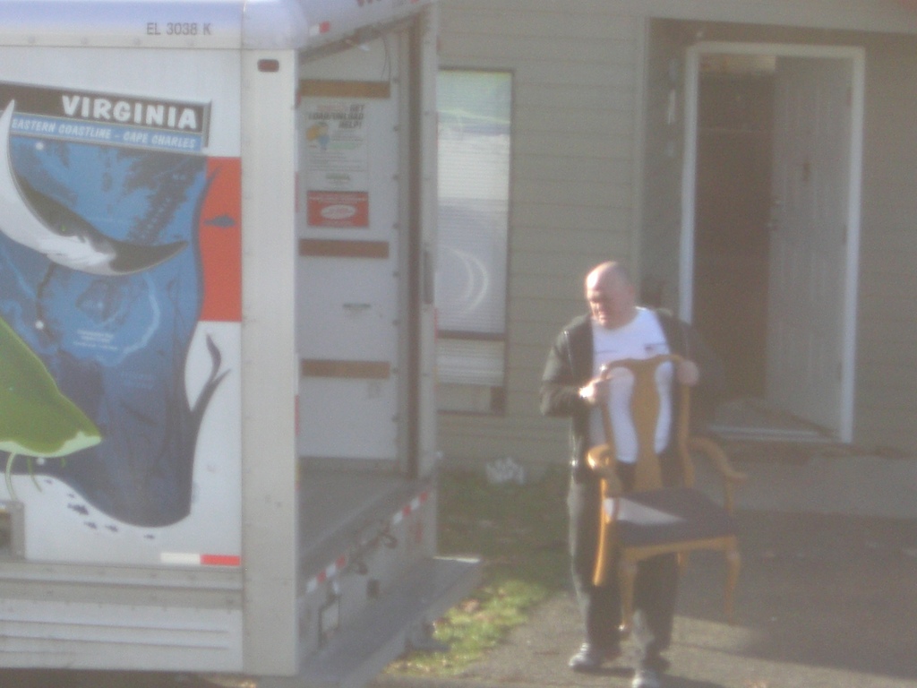 This is the piece of scum, two-bit crack dealer across the street from me moving his s@#t out!
