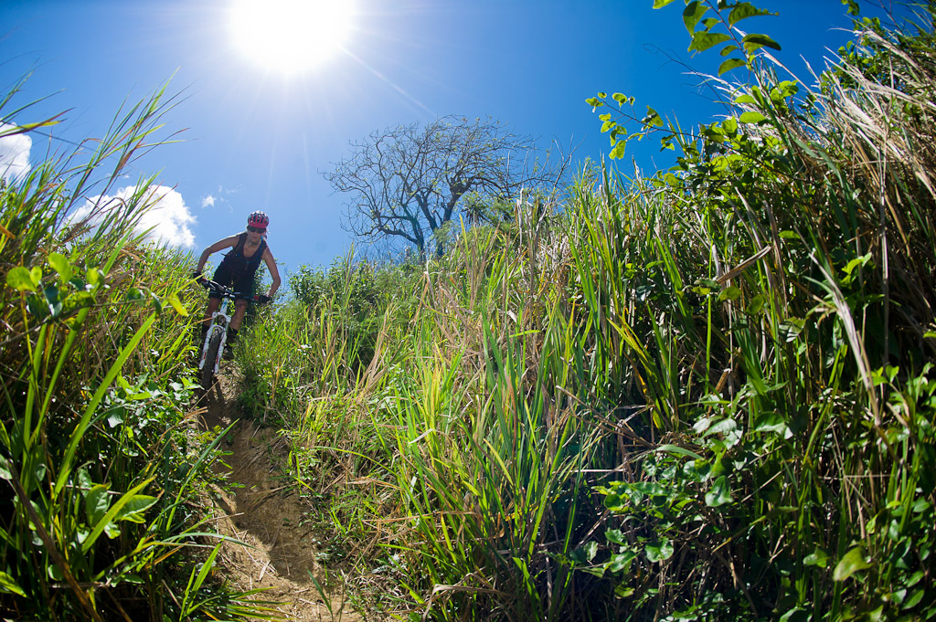 Katie Holden rides her bike on trails near Robins Bay in Jamaica at the Jamaica Fat Tyre Festival.