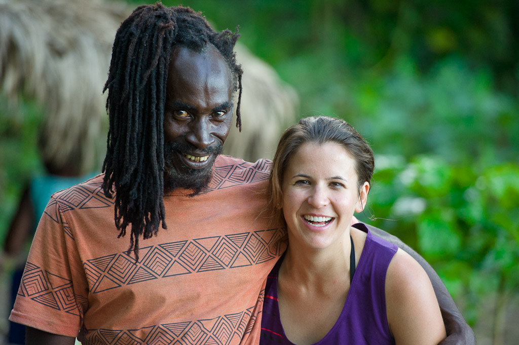 Katie Holden poses with trail builder Natty Grant at the black sand beach near Robins Bay in Jamaica at the Jamaica Fat Tyre Festival.